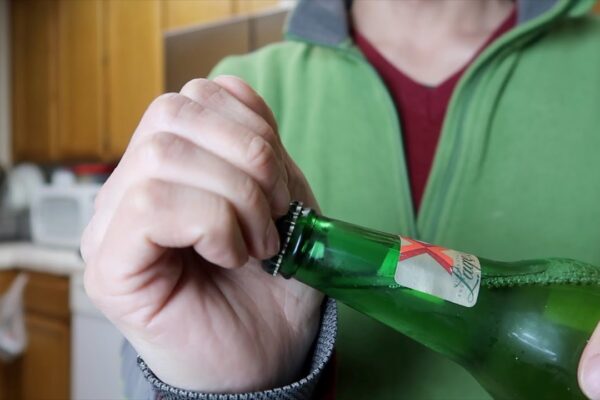 How To Open a Bottle Cap With Bare Hands [5 Different Ways]